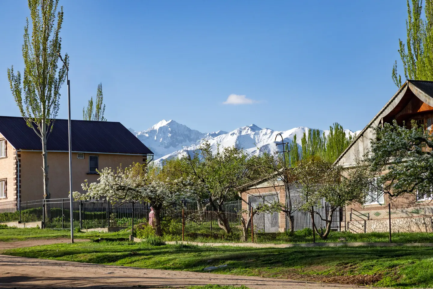 Houses and mountains in Svetlana Polyana in spring