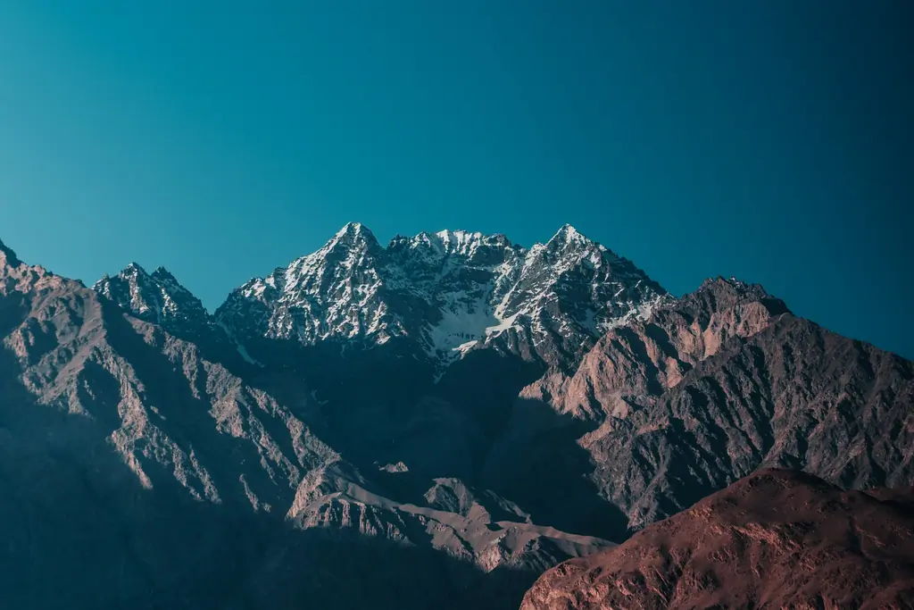 gray rocky mountain under blue sky during daytime