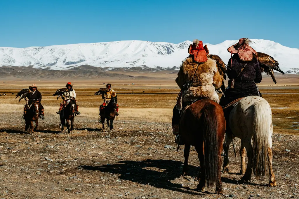 Hunter on horseback with an eagle, Altai Mountains, Mongolia