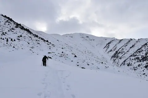 Ski touring to the 3000 noname peak backside Oruusay resort
