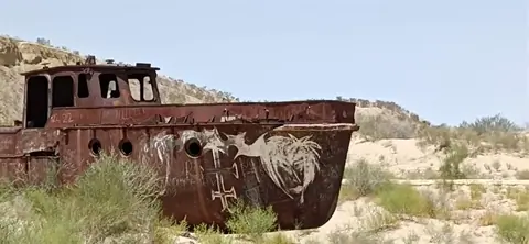 The Moynaq Cemetery Ship, also known as the Moynaq Ship Graveyard, is a haunting and symbolic sight located in the town of Moynaq in Uzbekistan