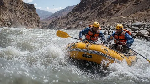 White water rafting action scene on the fast-flowing, rugged waters of Afghanistan’s Kabul River
