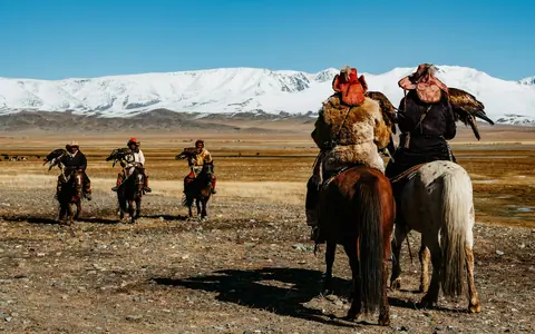 Hunter on horseback with an eagle, Altai Mountains, Mongolia