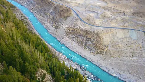 Blue river flowing through Karakoram mountain range In Hunza and Nagar valley Pakistan