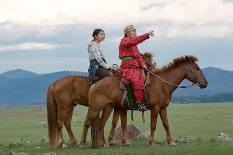 Mongolian nomads are at their daily tasks, such as dairy processing, traditional cuisine, music, animal care, milking, livestock guarding and more