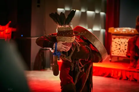 Mongolian dancing with folkloric costumes and instrument