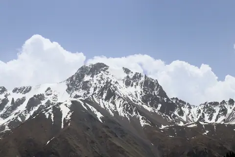 A rocky peak with a small glacier in the Barskoon valley