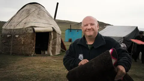 Tourist and yurt at Son Kul