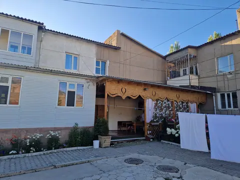 View of the house from outside and view of terrasse under roof