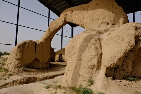 Archaeological remains in Balkh, Afghanistan, traditionally believed to mark the birthplace of the poet Rumi—crumbling mud-brick walls in a dry, historic landscape.