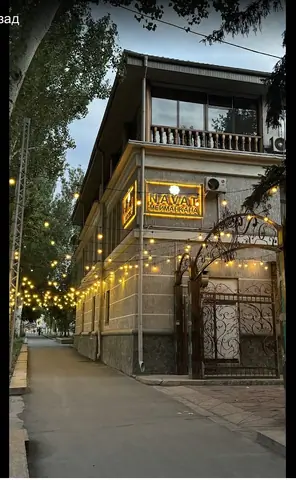 Street view of the hotel building Navat and main entrance