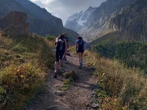 Running into a wonderful green alpine valley of Tien Shan range