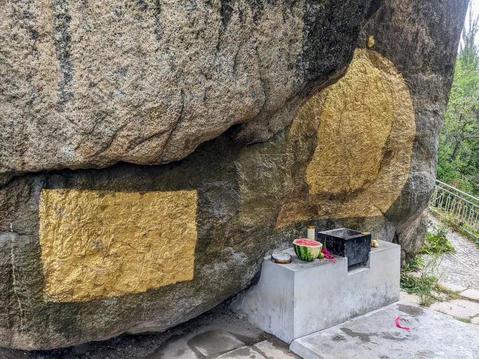 Issyk Ata carved Buddha and Tibetan scripture