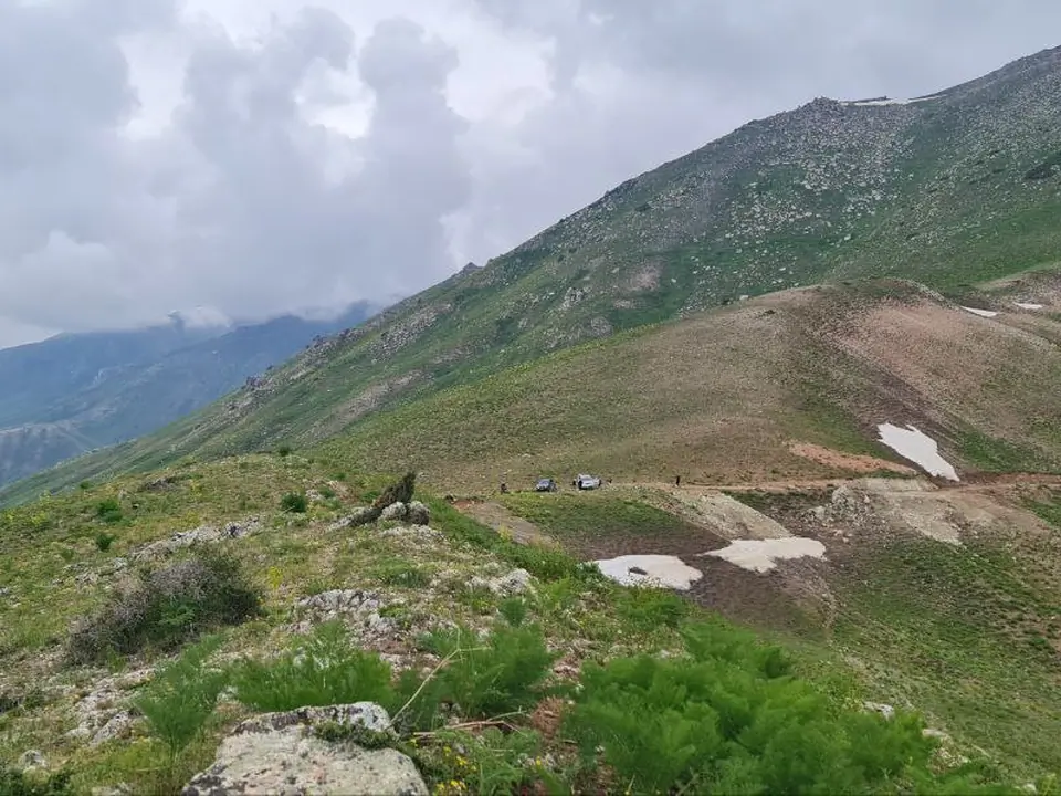 Mountains and green pasture or Chatkal mountains