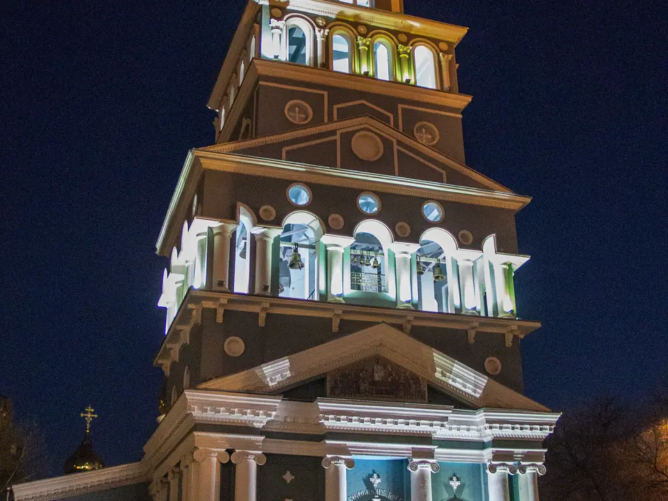 View by night of the main bell tower, painted in light blue and white, with a gilded onion dome at the top of the Cathedral of the Assumption of the Virgin in Tashkent