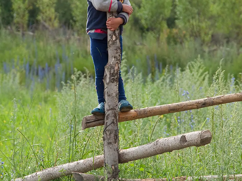 Boy on fence, Barskoon village