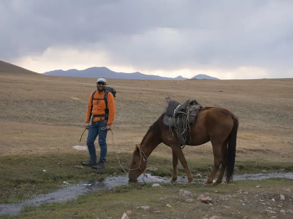 Tourist with horse near Song Kul lac