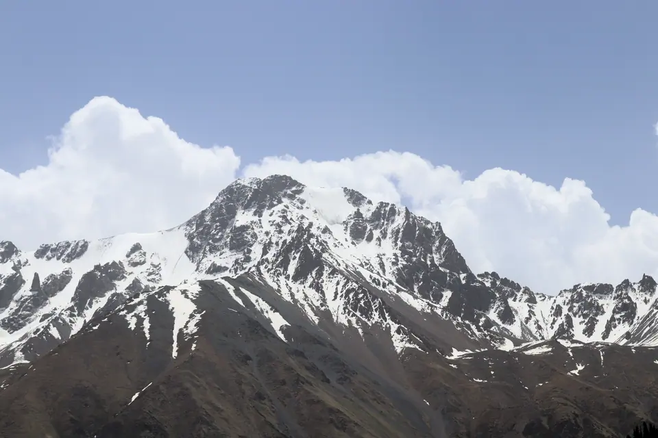 A rocky peak with a small glacier in the Barskoon valley