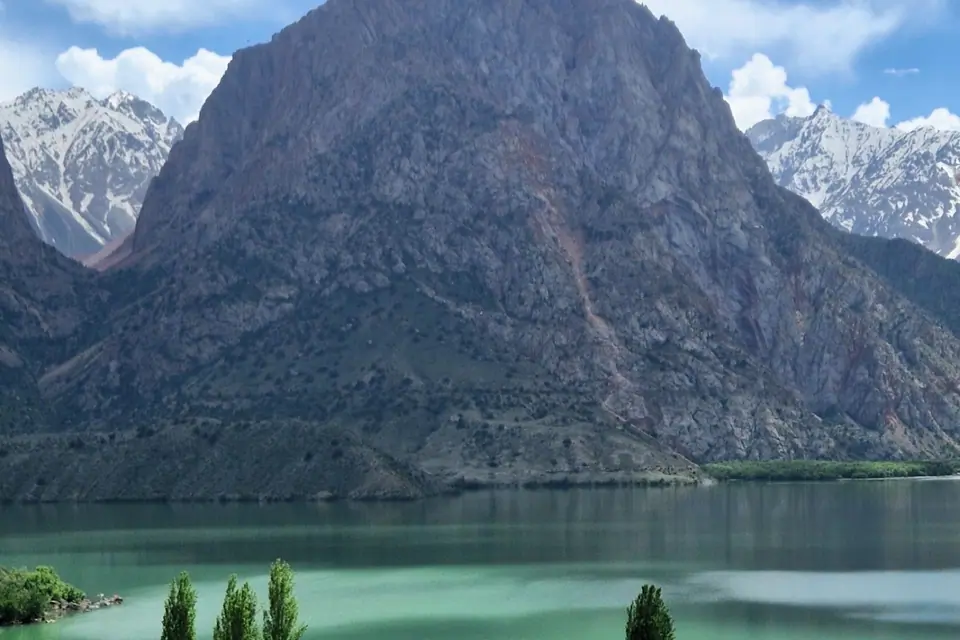 Wide view of the Hat of the Great Alexander and the turquoise lake of Iskenderkul