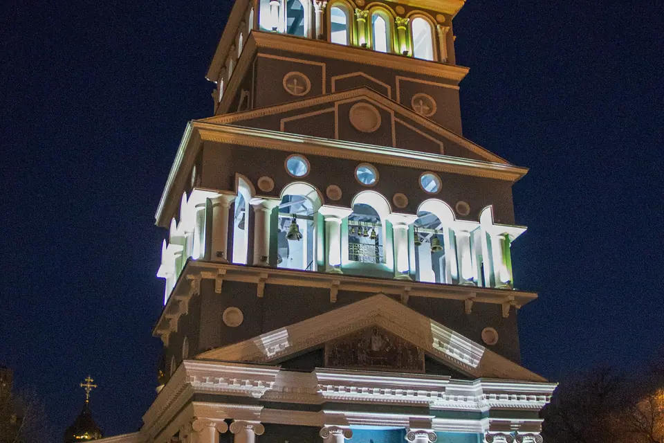 View by night of the main bell tower, painted in light blue and white, with a gilded onion dome at the top of the Cathedral of the Assumption of the Virgin in Tashkent