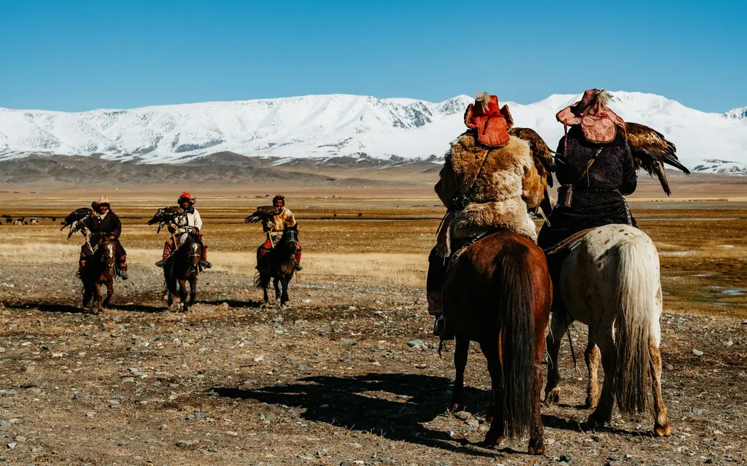 Hunter on horseback with an eagle, Altai Mountains, Mongolia