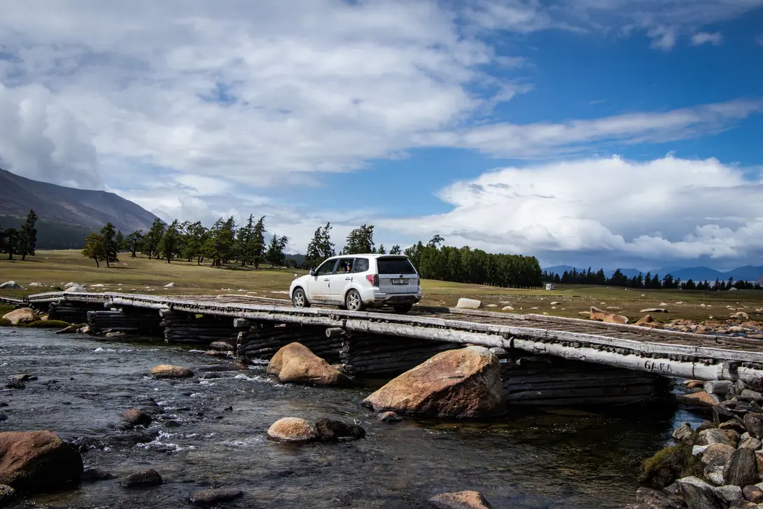 View of a car crossing the bridge on the river