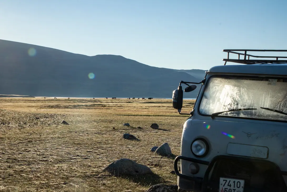 A UAZ bus arrive in the meadows of the Syrgali valley in Mongolia