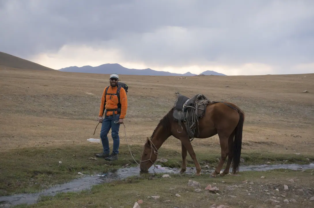 Tourist with horse near Song Kul lac